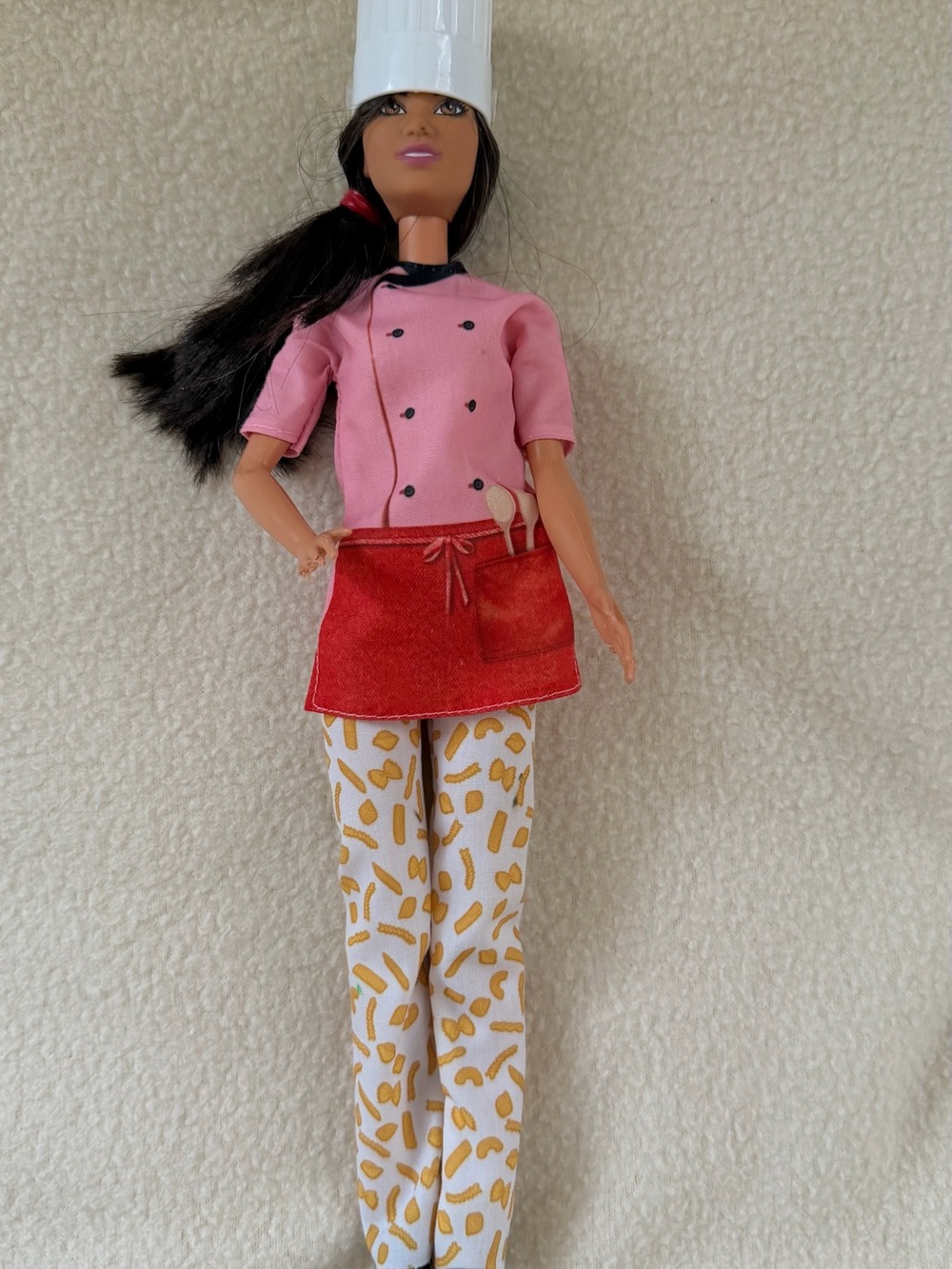Barbie Chef Doll Brunette with Pink Jacket, Apron & Macaroni Print Pants Mattel